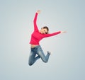 Happy young woman jumping in air or dancing Royalty Free Stock Photo