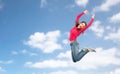 Happy young woman jumping in air or dancing Royalty Free Stock Photo