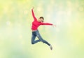 Happy young woman jumping in air or dancing Royalty Free Stock Photo