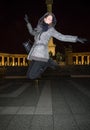 Happy young woman jumping high at Heroes` Square Budapest, Hunga Royalty Free Stock Photo