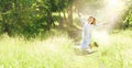 Happy Young Woman Enjoying Summer on the Green Meadow. Royalty Free Stock Photo