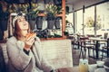 Happy young woman laughing while eating a slice of pizza Royalty Free Stock Photo