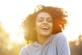 Happy young woman laughing outdoors Royalty Free Stock Photo