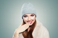 Happy young woman laughing. Pretty model girl in gray hat on white background