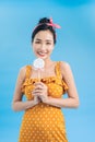 Happy young woman with lollipop candy isolated on blue Royalty Free Stock Photo