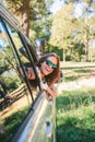 Happy young woman looking back through the window car Royalty Free Stock Photo