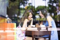 Happy young woman looking at phone in coffee shop Royalty Free Stock Photo