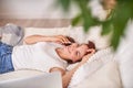 Happy young woman lying on a bed and talking on a mobile phone. Freelance Royalty Free Stock Photo