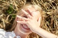 Happy young woman lying on cereal field Royalty Free Stock Photo