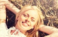 Happy young woman lying on cereal field Royalty Free Stock Photo