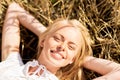 Happy young woman lying on cereal field Royalty Free Stock Photo