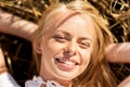 Happy young woman lying on cereal field Royalty Free Stock Photo