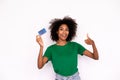 Happy young woman making thumb up and holding credit card Royalty Free Stock Photo