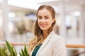 Happy young woman in mall or business center Royalty Free Stock Photo