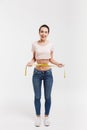 happy young woman measuring her waist Royalty Free Stock Photo