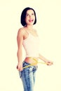 Happy young woman measuring her waist Royalty Free Stock Photo