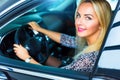 Happy young woman in the modern luxury car Royalty Free Stock Photo