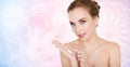 Happy young woman with moisturizing cream on hand Royalty Free Stock Photo