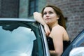 Happy young woman near the car. Royalty Free Stock Photo