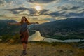 Happy young woman near Jvari Monastery of Georgia