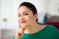 Happy young woman with pencil thinking Royalty Free Stock Photo