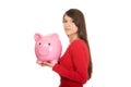 Happy young woman with piggybank.