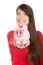 Happy young woman with piggybank.