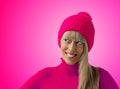 Happy young woman with pink winter hat