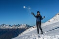 Happy young woman playing snowball fight on the snow day Royalty Free Stock Photo