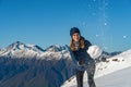 Happy young woman playing snowball fight on the snow day Royalty Free Stock Photo