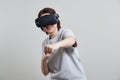 Happy young woman playing on VR glasses indoor, Virtual reality concept with young girl having fun with headset goggles Royalty Free Stock Photo