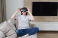 Happy young woman playing on VR glasses indoor, Virtual reality concept with young girl having fun with headset goggles Royalty Free Stock Photo