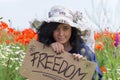 Happy young woman in the poppies field Royalty Free Stock Photo