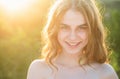 Happy young woman posing outdoor. Teen smiling girl in summer casual outfit. Outdoor female portrait. Royalty Free Stock Photo