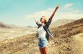 Happy young woman raises hands up on a hiking trail on top of the mountain, Tenerife, Canary Islands Royalty Free Stock Photo