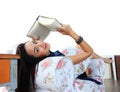 Happy young woman reading a book at home Royalty Free Stock Photo