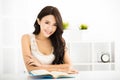 Happy young woman reading book Royalty Free Stock Photo