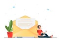 Happy young woman reading mail with envelop on the background, mail and messaging concept, email marketing concept, new email