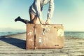 Happy young woman ready to travel with her suitcase Royalty Free Stock Photo