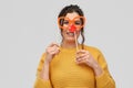 Happy young woman with red clown nose and glasses Royalty Free Stock Photo