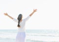 Happy young woman rejoicing at seaside . rear view Royalty Free Stock Photo