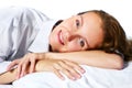 Happy young woman relaxing in bed Royalty Free Stock Photo