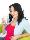 Happy Young Woman Relaxing Drinking A Large Glass of Fresh Milk Royalty Free Stock Photo