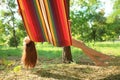 Happy young woman resting in comfortable hammock at garden Royalty Free Stock Photo