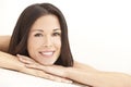 Happy Young Woman Resting on Hands in Spa