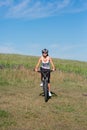 Happy Young Woman riding bicycle outside Royalty Free Stock Photo