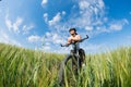 Happy Young Woman riding bicycle outside Royalty Free Stock Photo