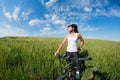 Happy Young Woman riding bicycle outside Royalty Free Stock Photo