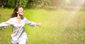 Happy Young Woman Enjoying Summer on the Green Meadow. Royalty Free Stock Photo