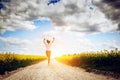 Happy young woman running and jumping for joy Royalty Free Stock Photo